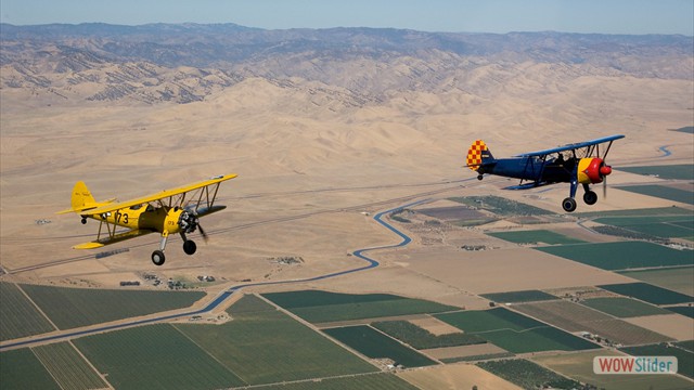 Stearman N54173 and Andreas Hotea in loose Formation-in Central Valley-1