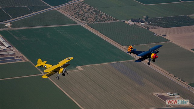 Stearman N54173 and Andreas Hotea in loose Formation-in Central Valley-2